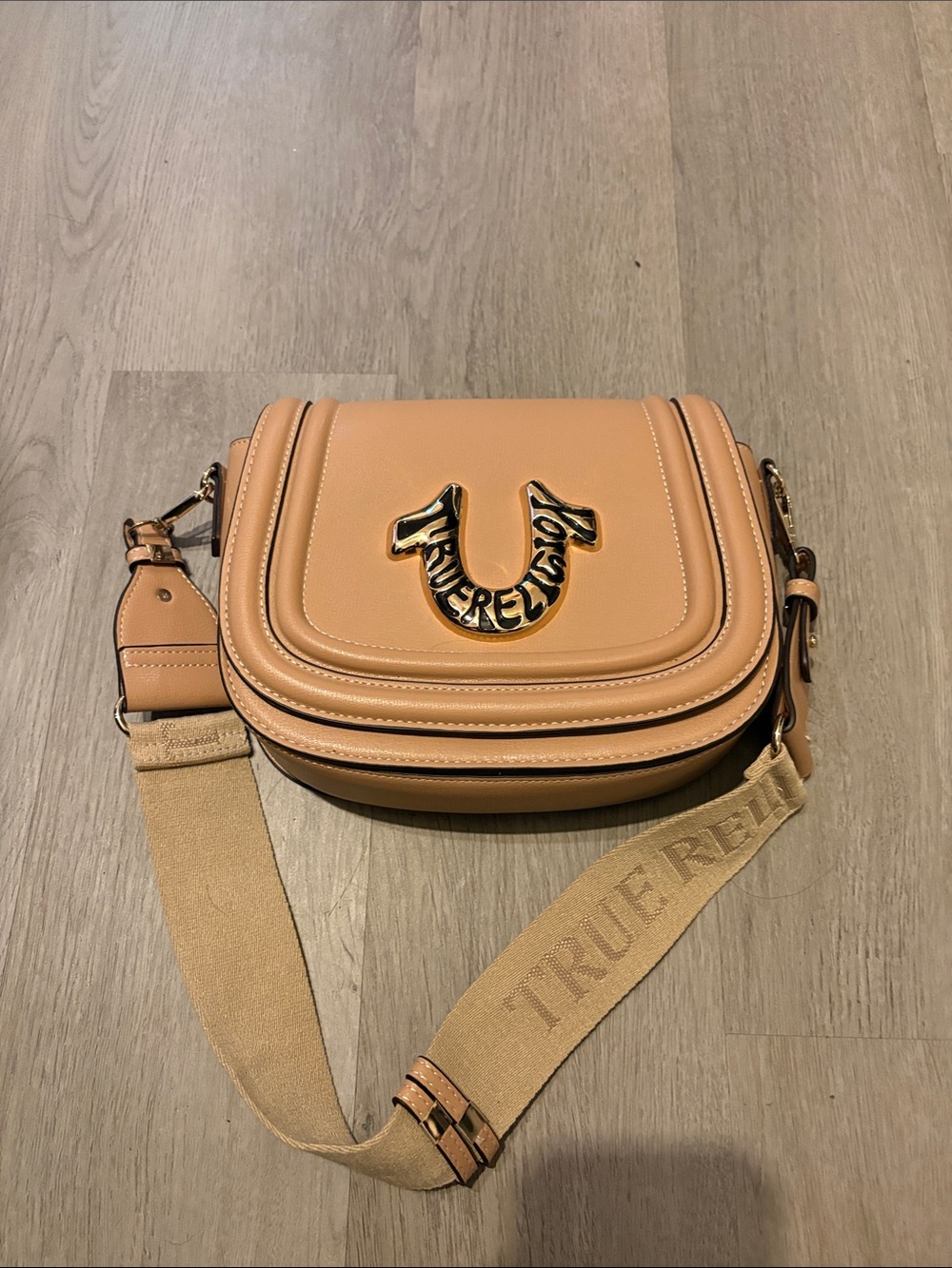 True Religion Caramel Leather Saddle Crossbody Bag with Gold Logo